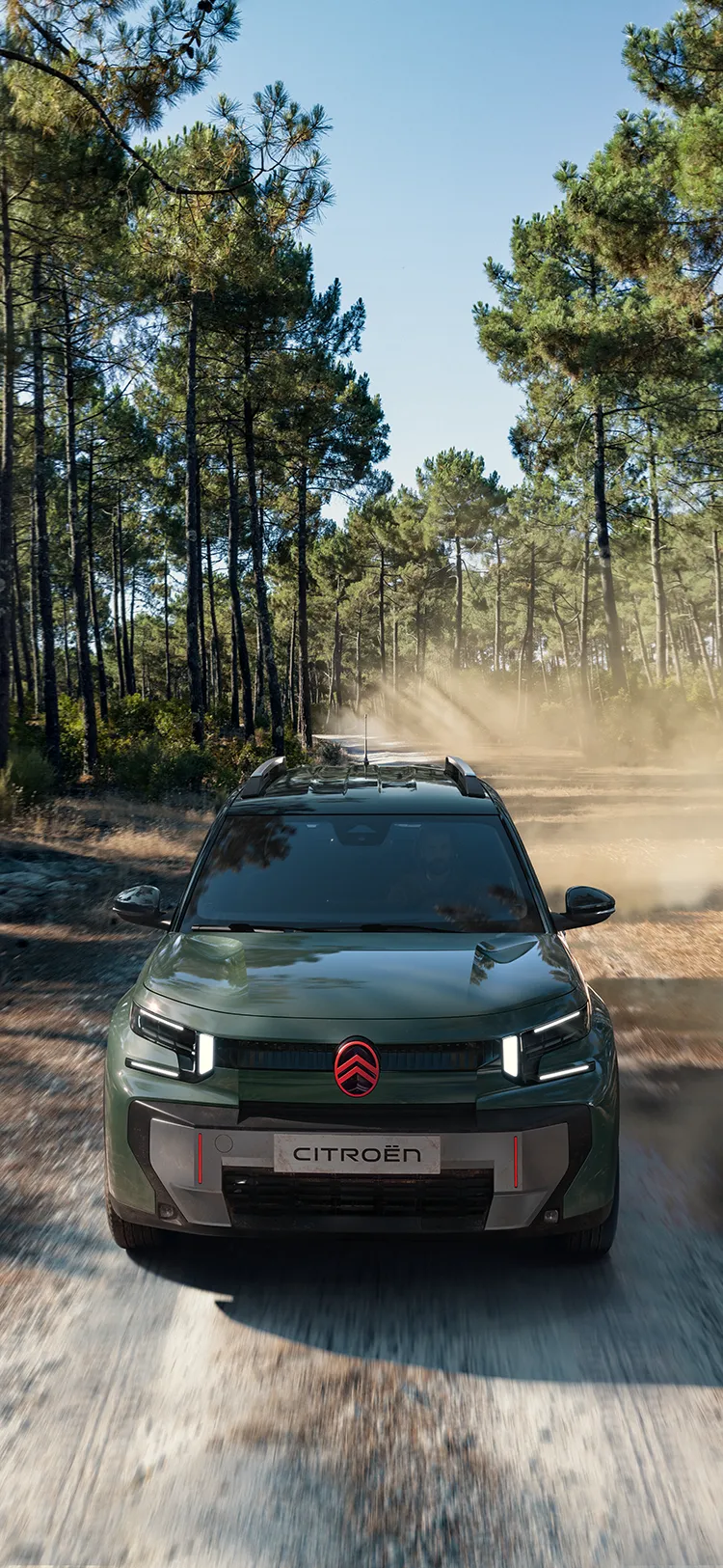 Aerial front view Citroën C3 Aircross SUV shows LED signature, Advanced Comfort, family SUV on forest trail